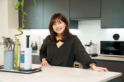 Woman in kitchen of London Living Rent property