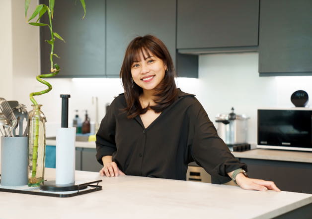 Woman in kitchen of London Living Rent property