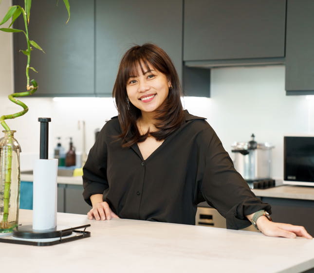 Woman in kitchen of London Living Rent property
