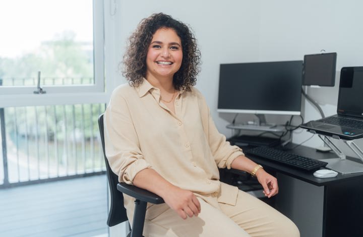 Woman sat at her desk