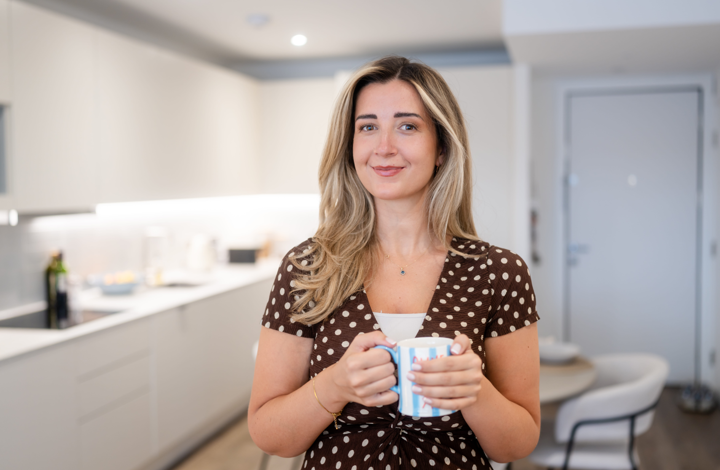 Woman in kitchen of Shared Ownership home at Chelsea Botanica