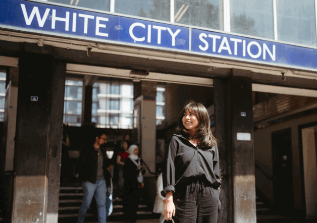 Woman standing outside White City station