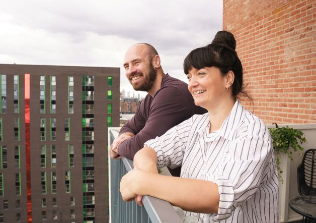 Robert and Kate - homeowners on balcony at Three Waters