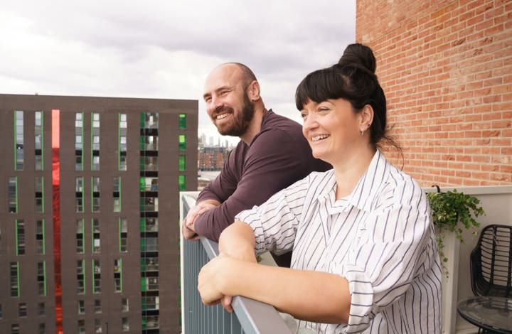 Robert and Kate - homeowners on balcony at Three Waters