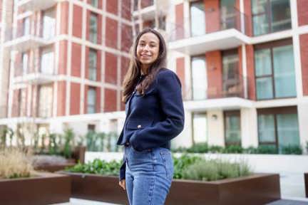 Woman standing outside Shared Ownership development