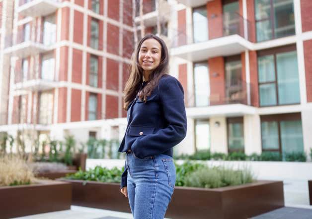 Woman standing outside Shared Ownership development