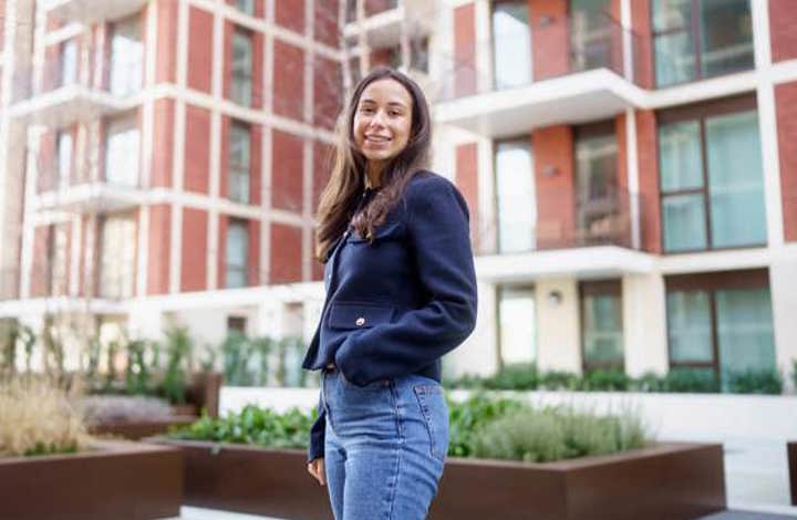 Woman standing outside Shared Ownership development