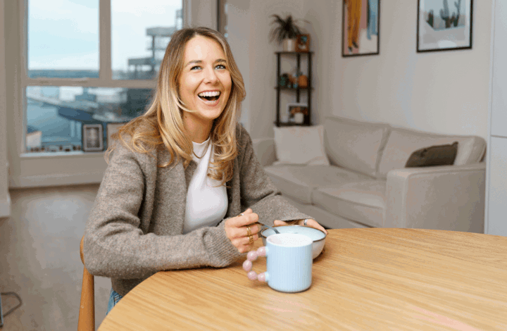 A woman sitting in the living room of her Shared Ownership home