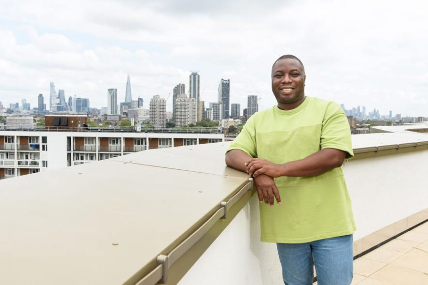 Man on rooftop terrace of Shared Ownership development
