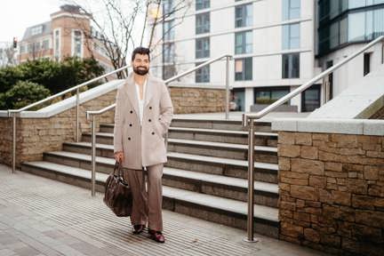 Man standing outside Shared Ownership home in London