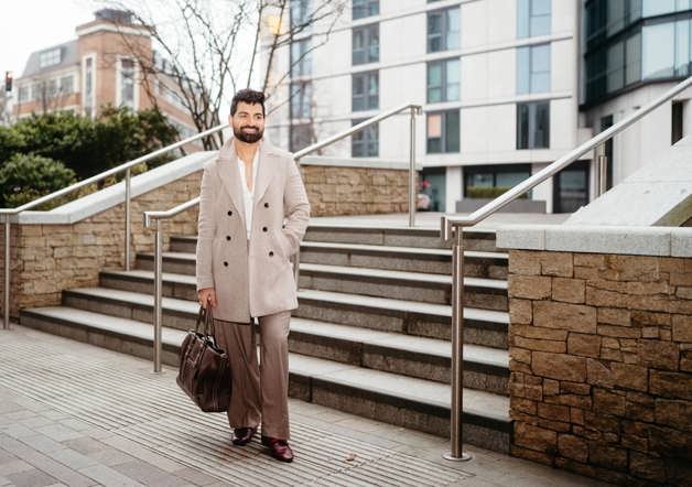Man standing outside Shared Ownership home in London