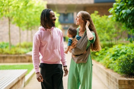 Two homeowners walking in garden of Shared Ownership development