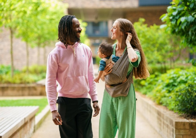 Two homeowners walking in garden of Shared Ownership development
