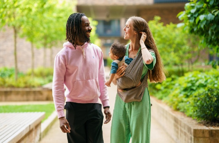 Two homeowners walking in garden of Shared Ownership development