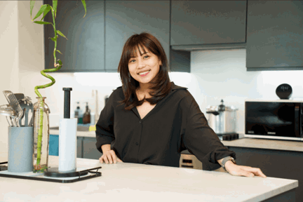 Lady in kitchen of London Living Rent property