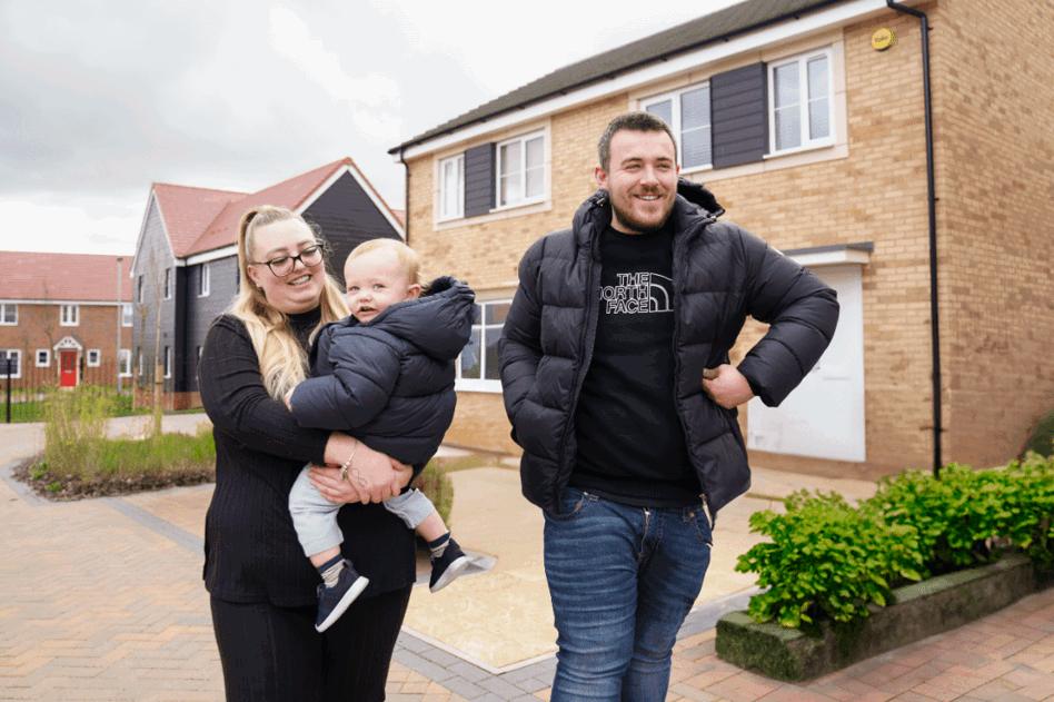 Two homeowners outside their Shared Ownership home