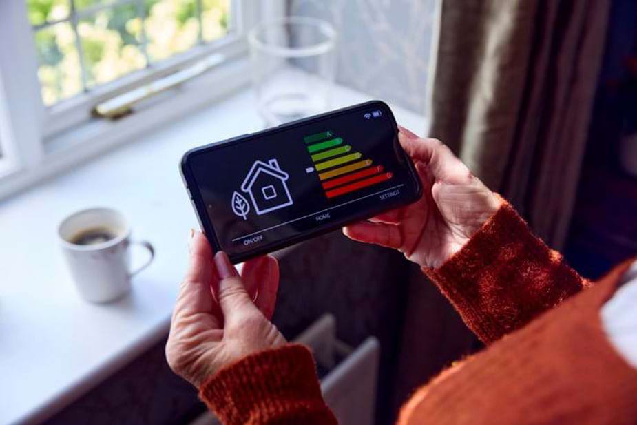Woman looking at energy efficiency of home