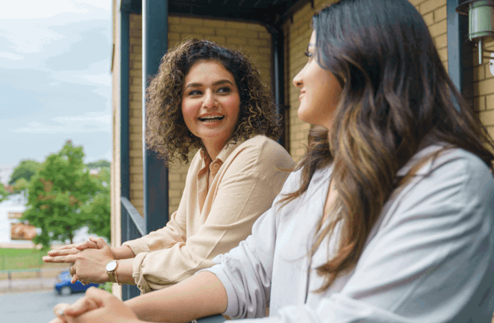 Two women on balcony of their Shared Ownership home in London