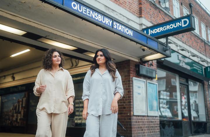 Two women coming out of Queensbury tube station