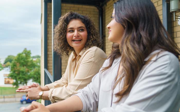 two women on their balcony