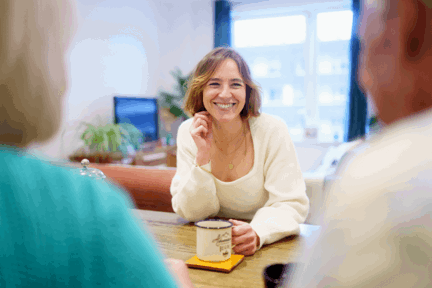 Woman sitting in living room of her Shared Ownership home