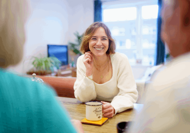Woman sitting in living room of her Shared Ownership home