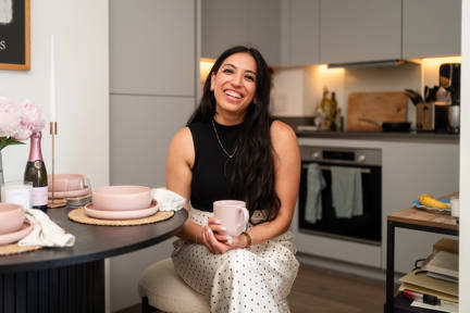 Woman sat in kitchen of Shared Ownership home