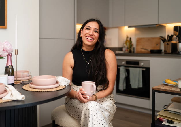 Woman sat in kitchen of Shared Ownership home