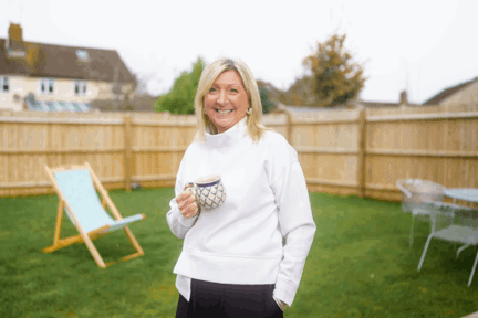 Woman in garden of her Shared Ownership home