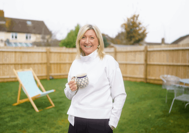 Woman in garden of her Shared Ownership home