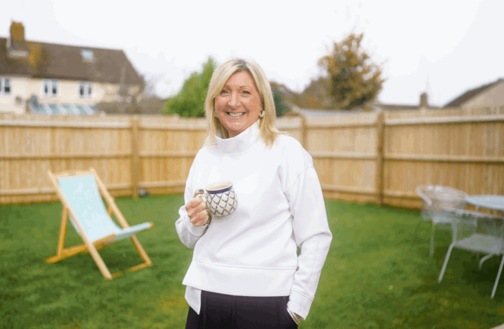 Woman in garden of her Shared Ownership home