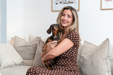 Woman sat on sofa in Chelsea Botanica Shared Ownership home