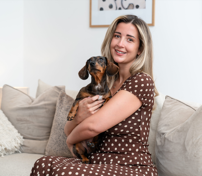 Woman sat on sofa in Chelsea Botanica Shared Ownership home