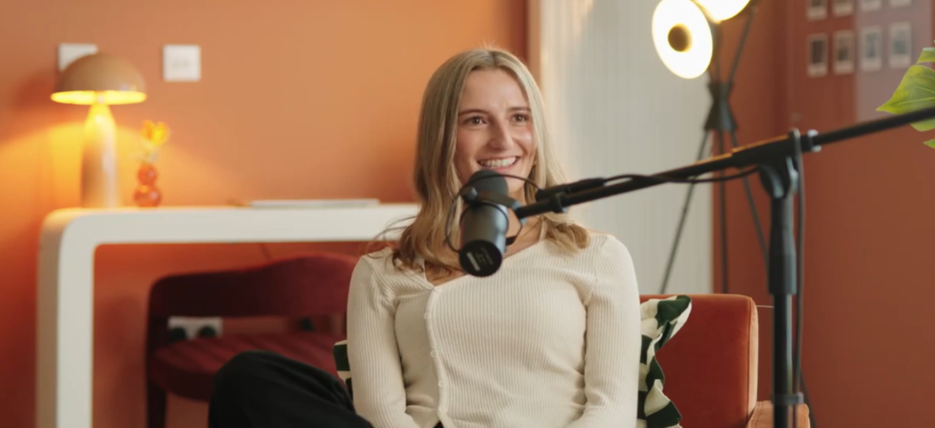 Woman sat with a microphone 